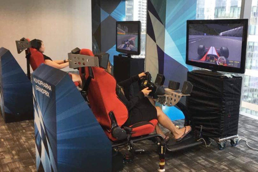2 Woman Playing with F1 Simulator