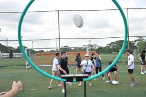 Team building with frisbee toss game